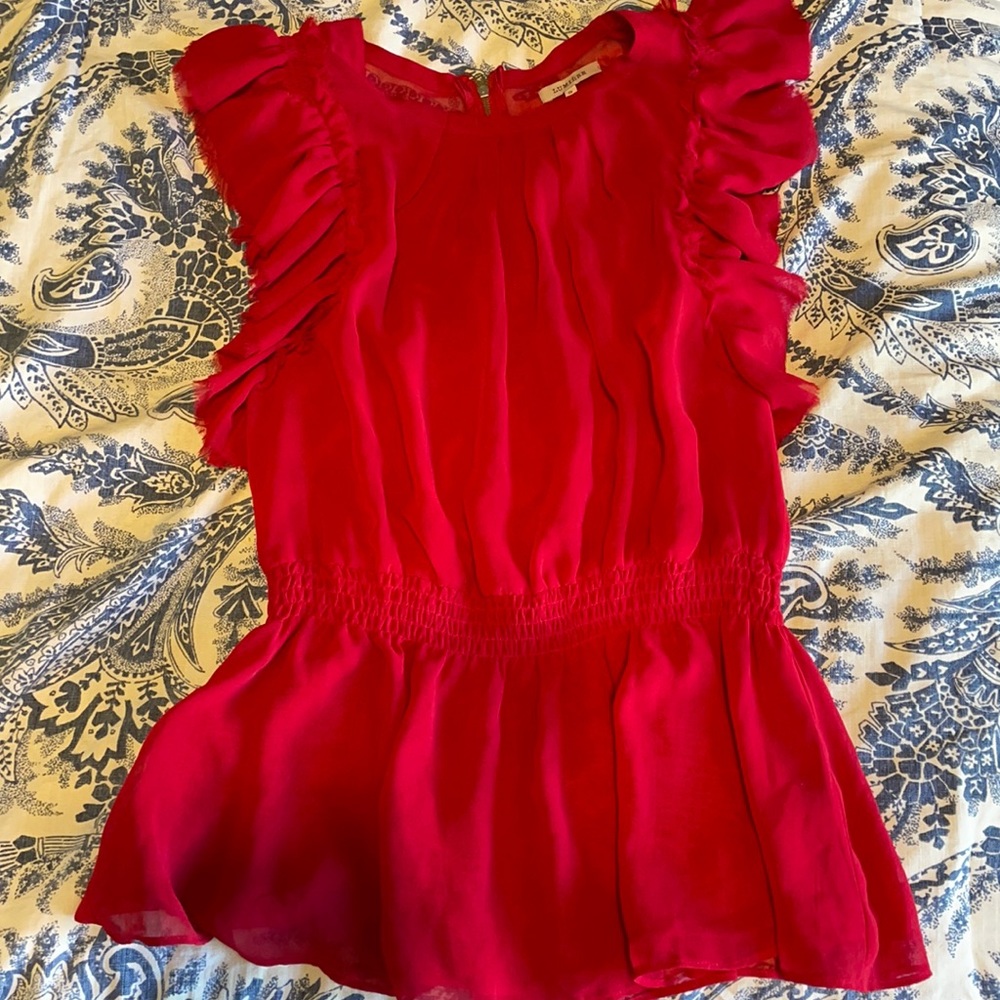 Red flouncy blouse. Sleeveless. Size small.